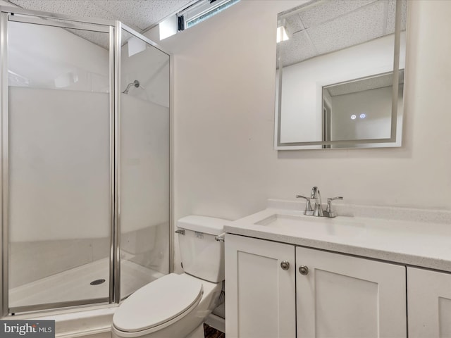 bathroom with vanity, toilet, and an enclosed shower