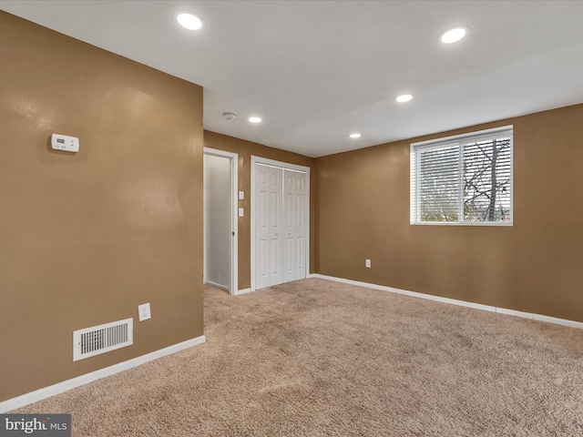 empty room with carpet flooring