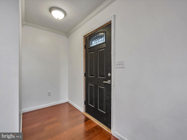 foyer entrance featuring dark hardwood / wood-style flooring and crown molding