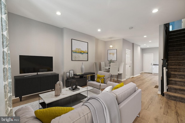 living room with light hardwood / wood-style flooring