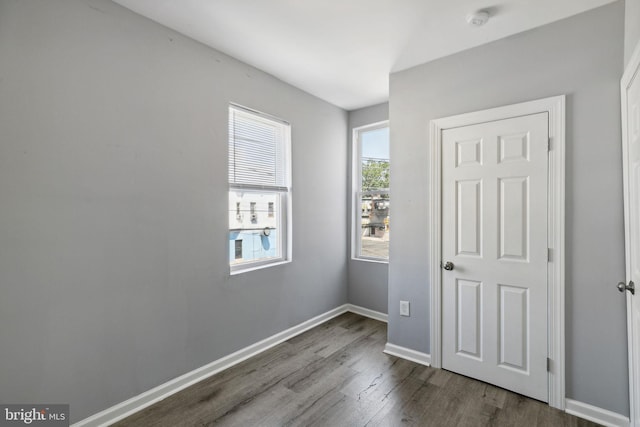 unfurnished bedroom with wood-type flooring