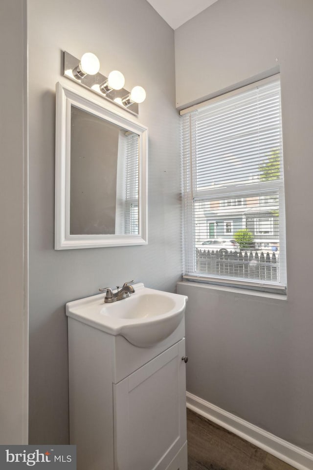 bathroom featuring vanity and wood-type flooring