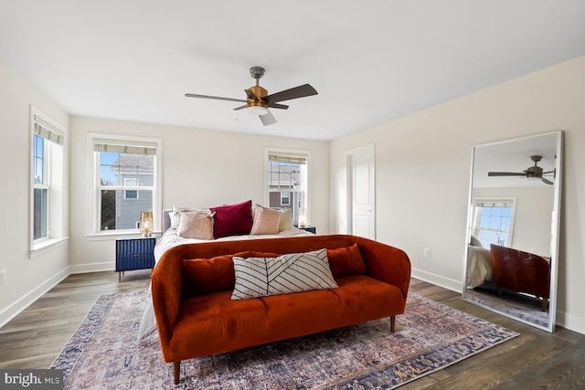 bedroom featuring ceiling fan and dark wood-type flooring