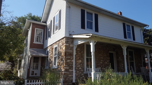 view of home's exterior featuring a porch