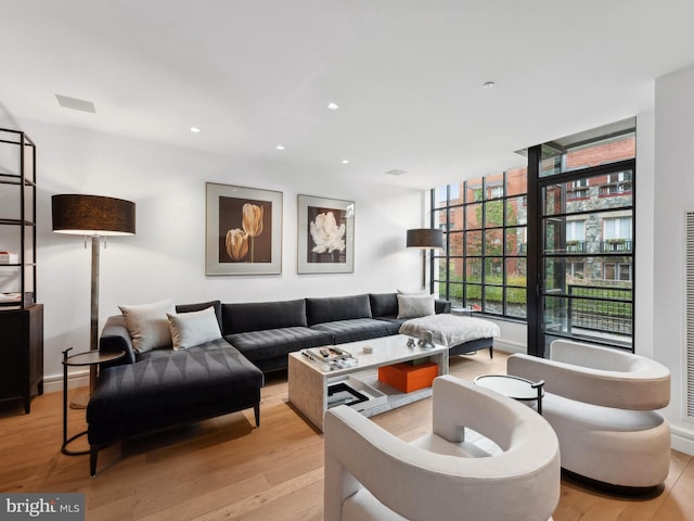 living room with light hardwood / wood-style floors