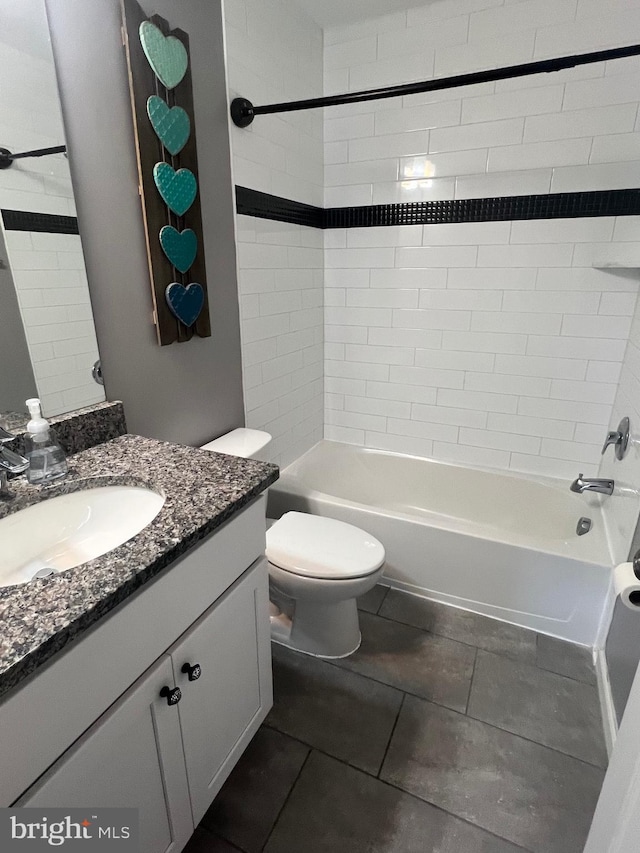 full bathroom with vanity, toilet, and tiled shower / bath combo