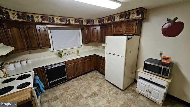 kitchen featuring dark brown cabinetry, sink, extractor fan, and white appliances