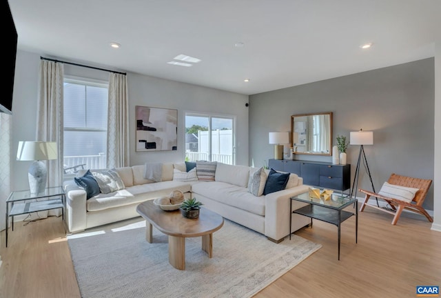 living room with light hardwood / wood-style floors