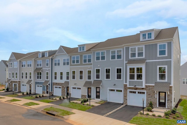 multi unit property featuring a garage