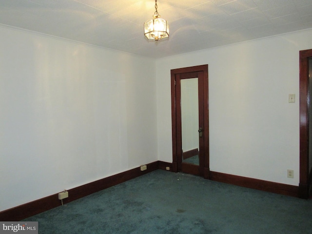 carpeted empty room with ornamental molding