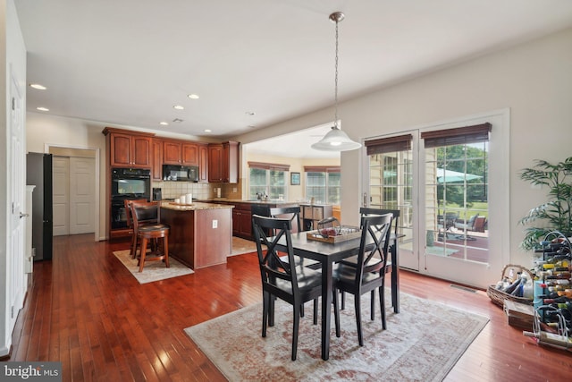 dining room featuring dark hardwood / wood-style flooring