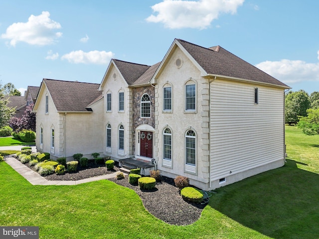 view of front of home with a front lawn