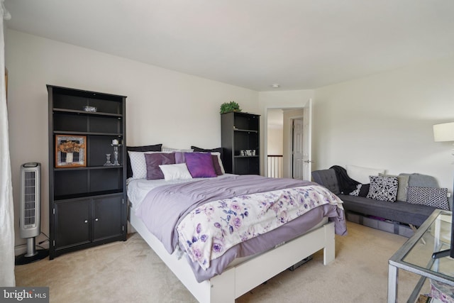 bedroom with light colored carpet