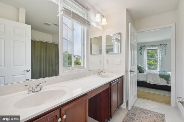 bathroom featuring tile patterned flooring and vanity