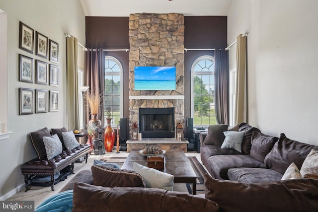 living room with a fireplace and a wealth of natural light