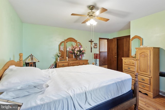 bedroom featuring light wood-type flooring and ceiling fan