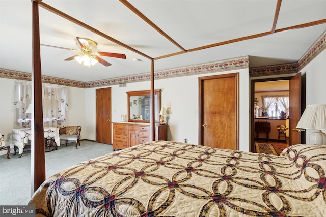 carpeted bedroom with ceiling fan