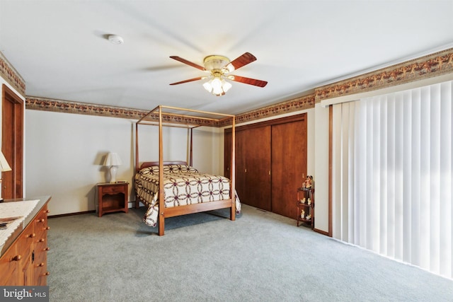 bedroom featuring ceiling fan and light colored carpet