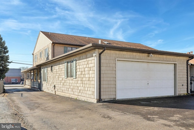 view of side of home with a garage