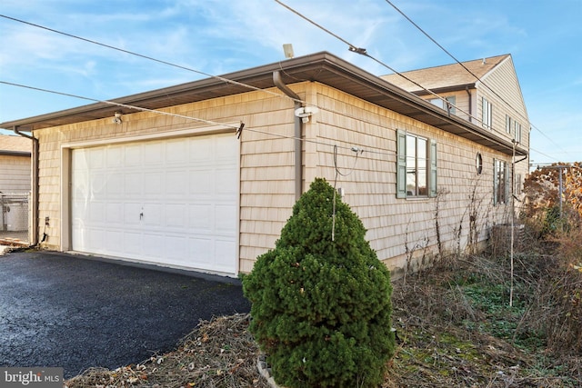 view of home's exterior with a garage