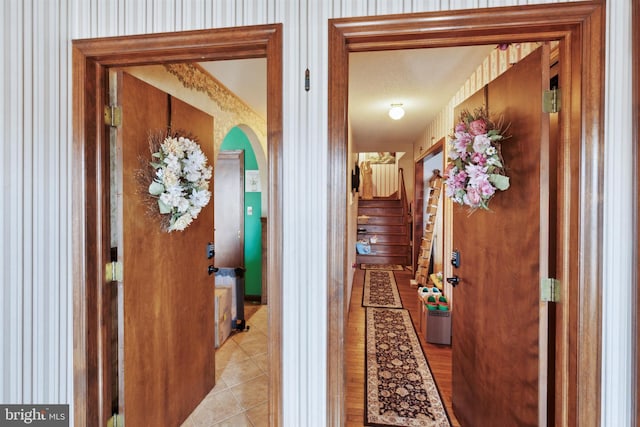 hall with light tile patterned flooring