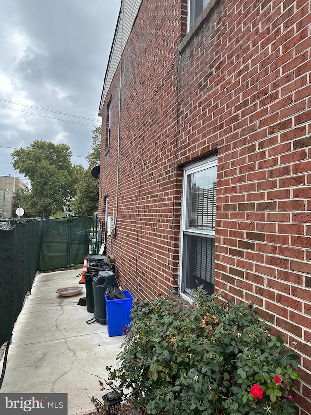 view of side of home featuring a patio area