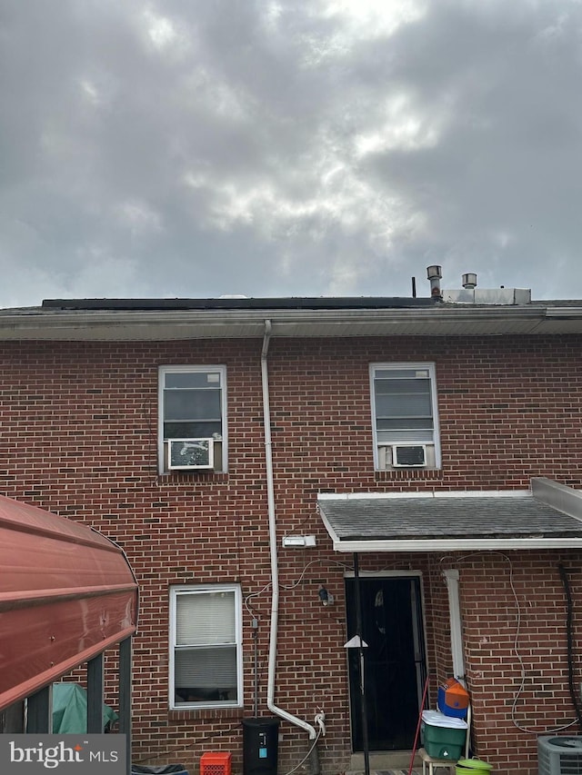 1601 W Venango St, Philadelphia, PA 19140 - rear view of property featuring brick siding and central air condition unit