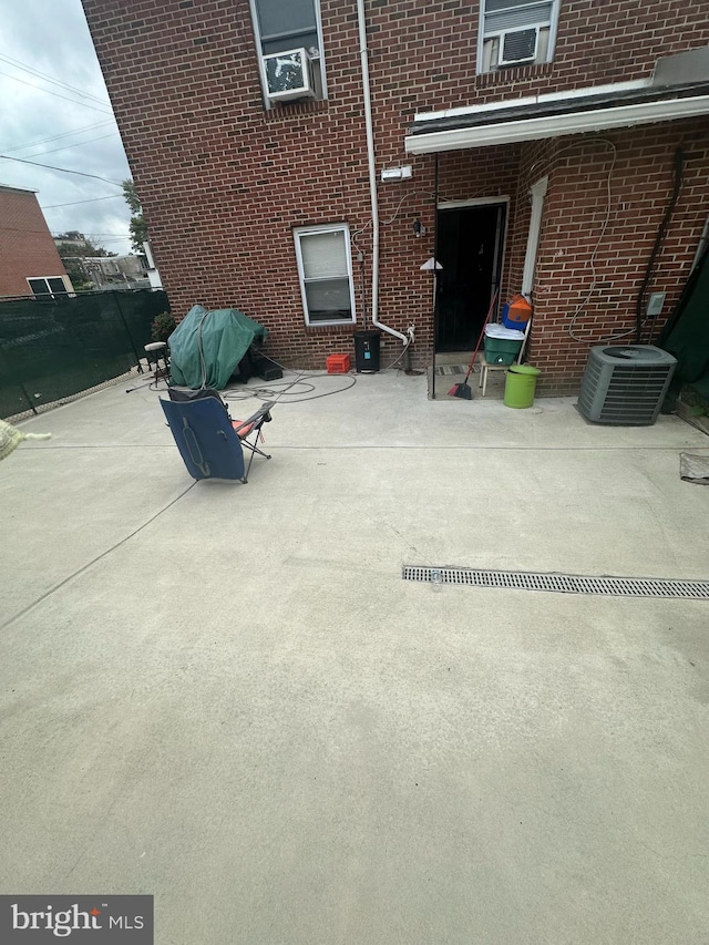 view of patio featuring central AC and cooling unit