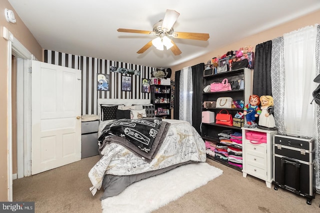 carpeted bedroom with ceiling fan