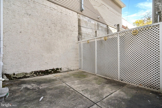 view of side of property featuring a patio area