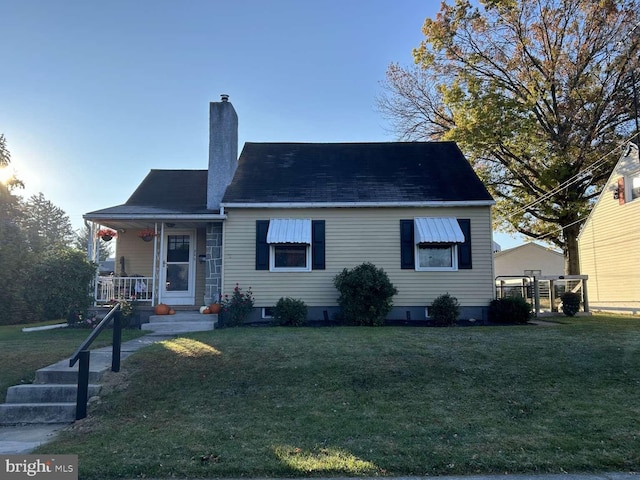 bungalow-style home with a front yard and a porch