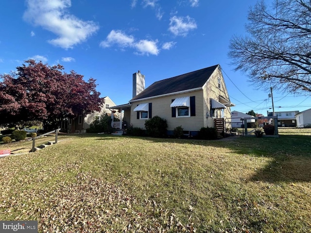 view of side of home featuring a lawn