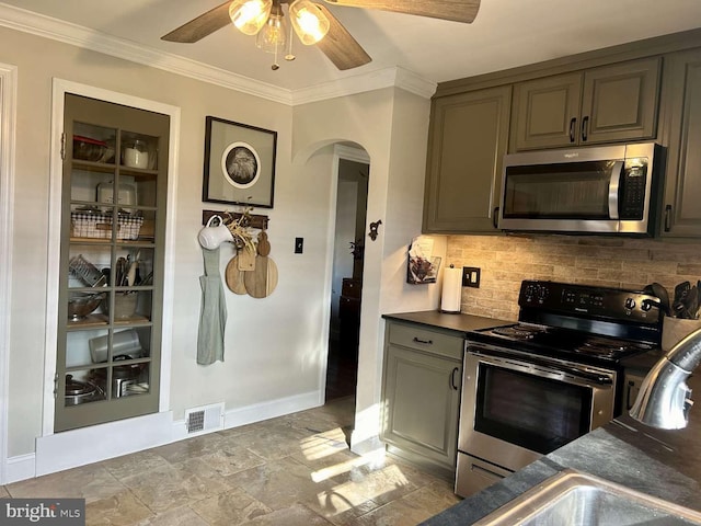 kitchen with ceiling fan, sink, stainless steel appliances, tasteful backsplash, and ornamental molding