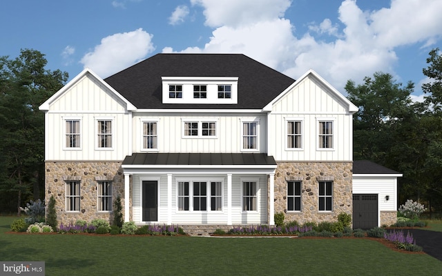 modern farmhouse featuring a garage, board and batten siding, a front lawn, and a standing seam roof