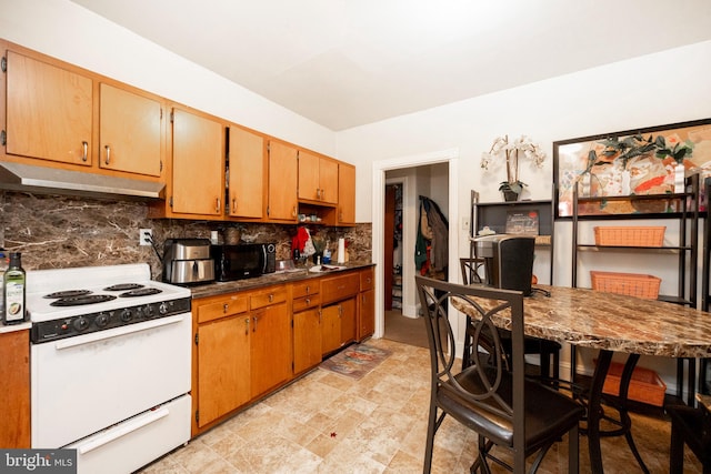 kitchen with decorative backsplash and white stove