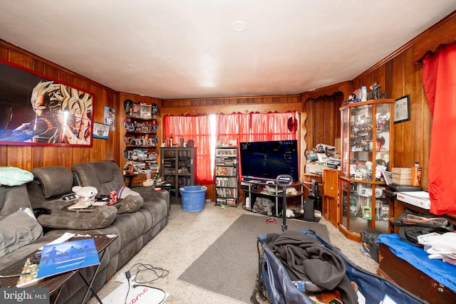 living room with carpet and wood walls