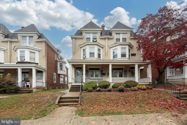 view of front of property featuring covered porch