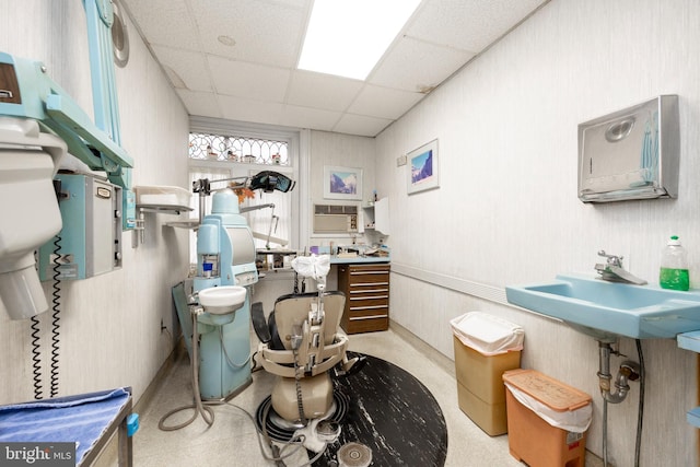 bathroom featuring a drop ceiling and sink