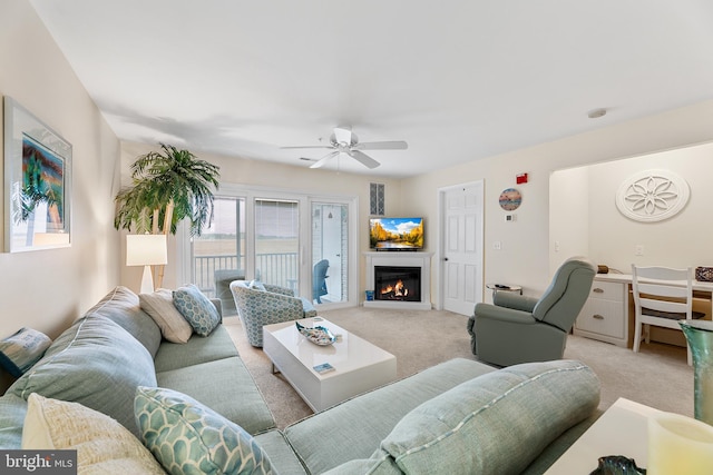 living room featuring ceiling fan and light carpet