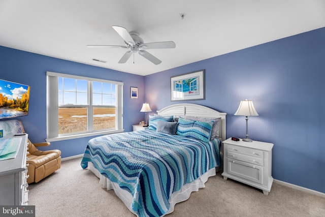 bedroom featuring light carpet and ceiling fan