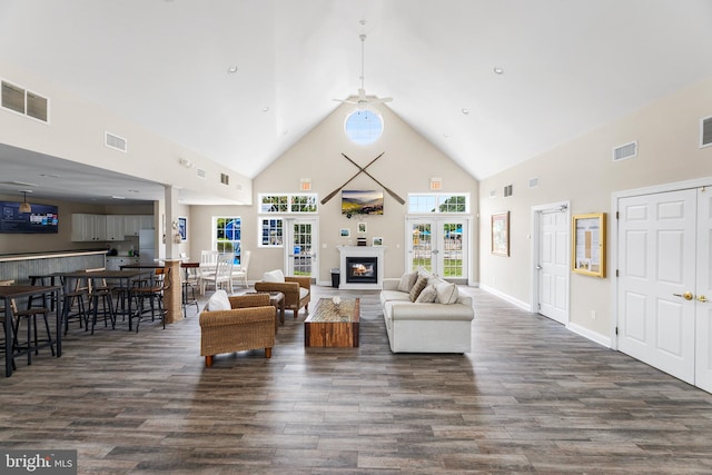 living room featuring ceiling fan, dark wood-type flooring, high vaulted ceiling, and french doors