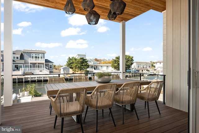 wooden deck featuring a water view