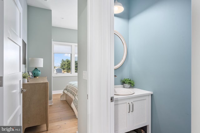 bathroom with vanity and hardwood / wood-style flooring