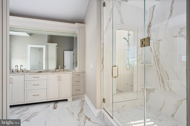 bathroom featuring vanity and a shower with door