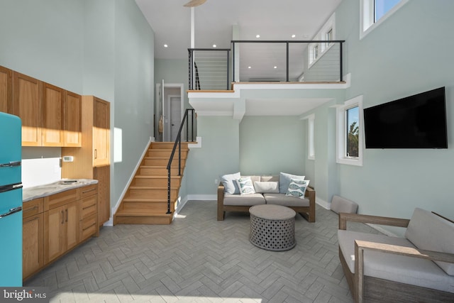 living room featuring a high ceiling