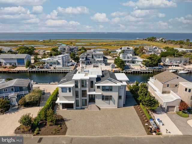 drone / aerial view with a water view