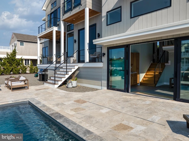 exterior space with a balcony and a patio