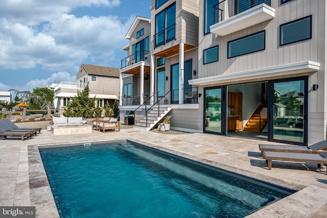 view of swimming pool with a patio area