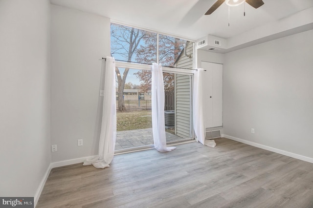 interior space featuring ceiling fan and light wood-type flooring