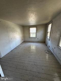 empty room with dark hardwood / wood-style floors